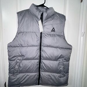 Brand new men’s size large puffer vest by Reebok